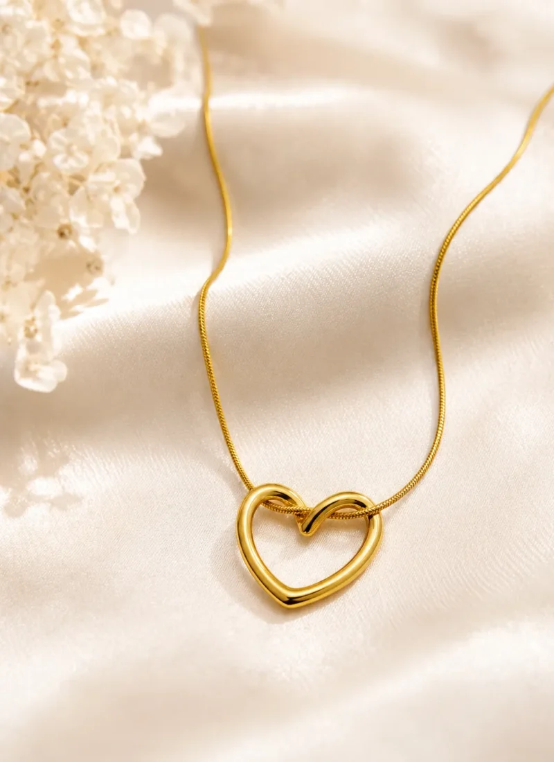 Open Heart Golden Necklace featuring a polished gold open heart pendant on a sleek snake chain