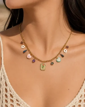 Golden Muse Charm Necklace featuring enamel hearts, floral charms, colorful crystals, and a vintage-inspired gold pendant
