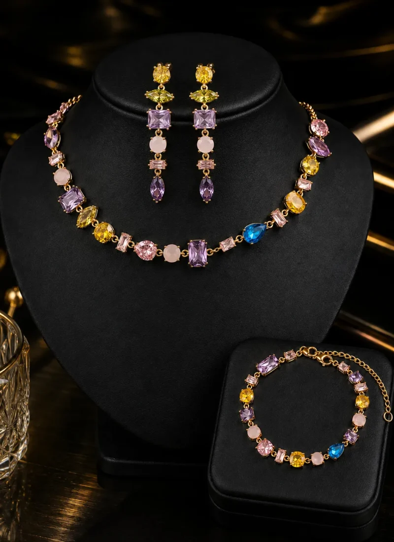 Aurora Luxe Jewellery Set featuring a multi-colour crystal necklace, matching bracelet, and statement drop earrings in gold finish