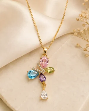 Butterfly Blossom Crystal Necklace featuring pink, blue, green, purple and white crystals in a gold floral butterfly pendant