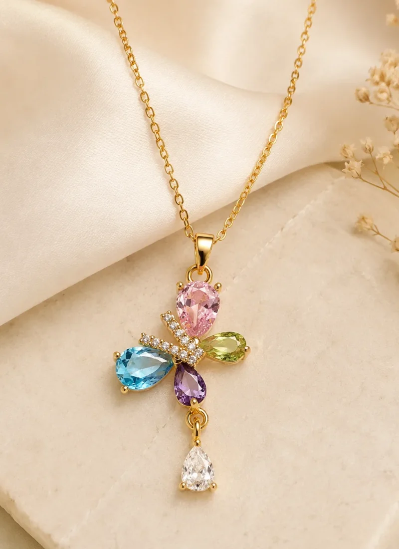 Butterfly Blossom Crystal Necklace featuring pink, blue, green, purple and white crystals in a gold floral butterfly pendant