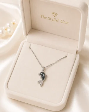 Dolphin Pendant Necklace featuring a silver dolphin pendant with marbled grey stone and crystal detailing