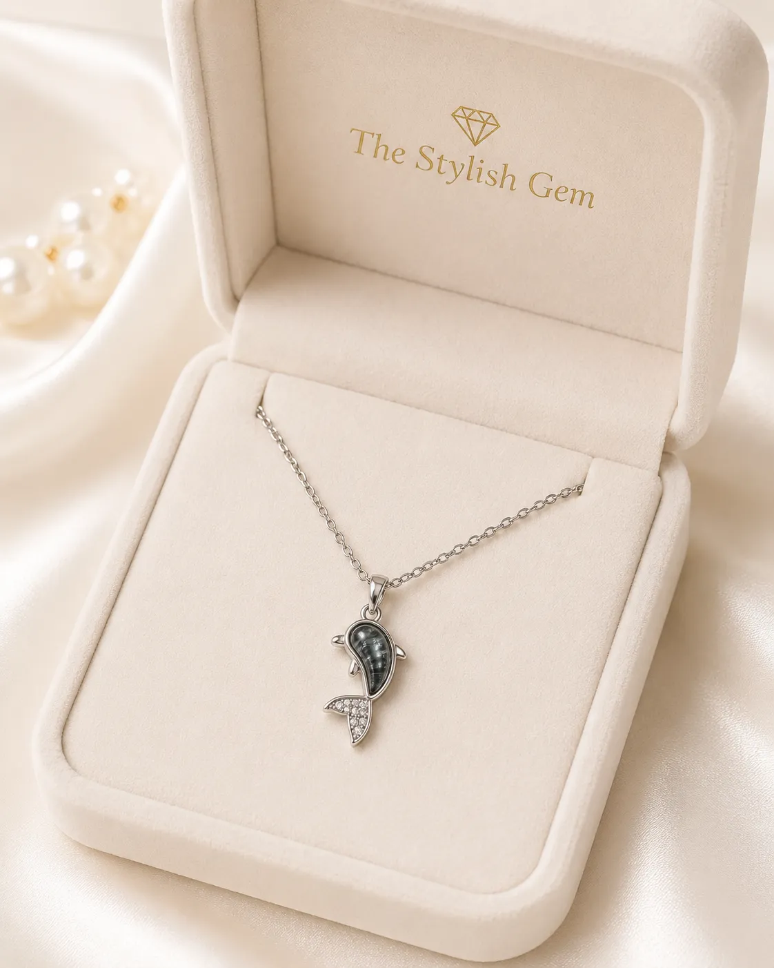 Dolphin Pendant Necklace Dolphin Pendant Necklace featuring a silver dolphin pendant with marbled grey stone and crystal detailing