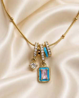 Blue Pink Crystal Charm Pendant Necklace featuring blush pink crystal, turquoise enamel accents, and sparkling white crystal charms
