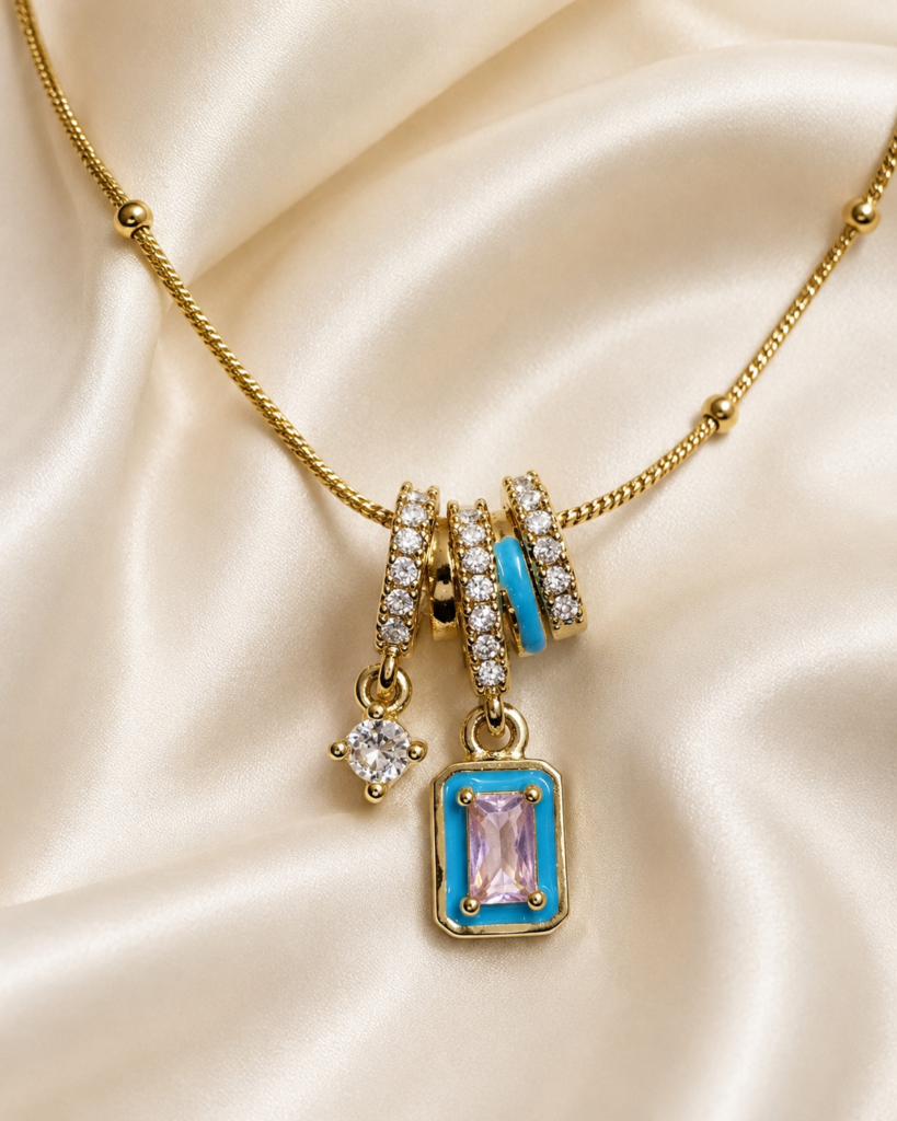 Blue Pink Crystal Charm Pendant Necklace featuring blush pink crystal, turquoise enamel accents, and sparkling white crystal charms