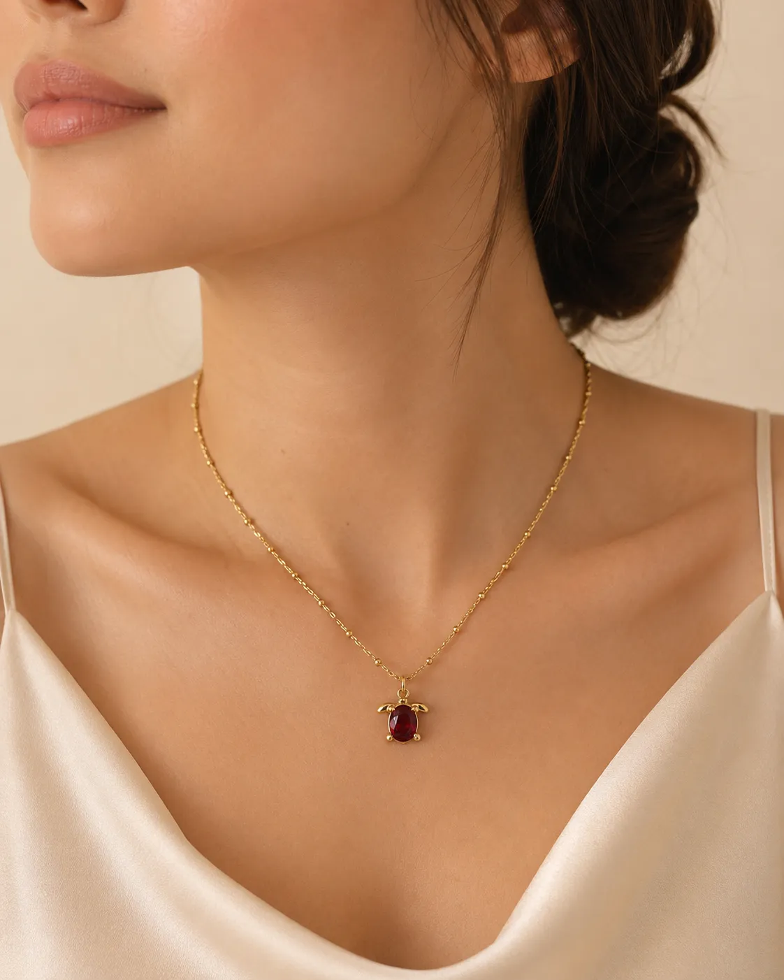 Ruby Turtle Pendant Necklace Ruby Turtle Pendant Necklace featuring a brilliant ruby-red crystal in a premium gold turtle design