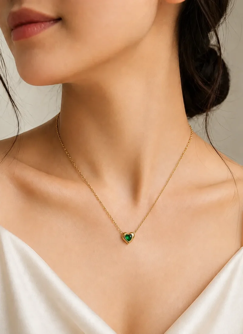 Green Heart Pendant Necklace featuring an emerald-green heart crystal set in a premium gold heart frame