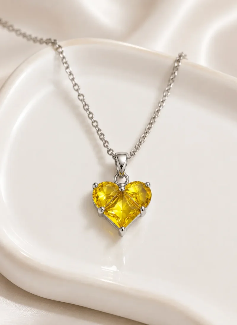 Yellow Stone Heart Pendant Necklace with brilliant yellow crystal stones in a premium silver finish