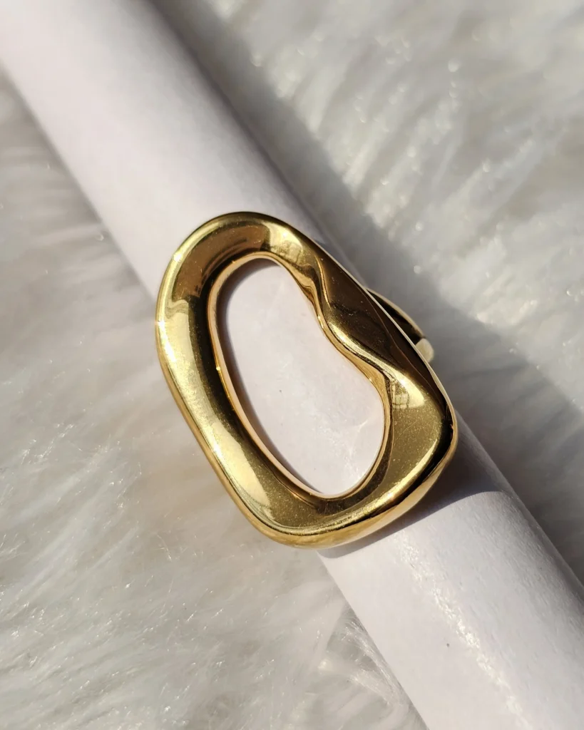 Gold tone sculptural open statement ring