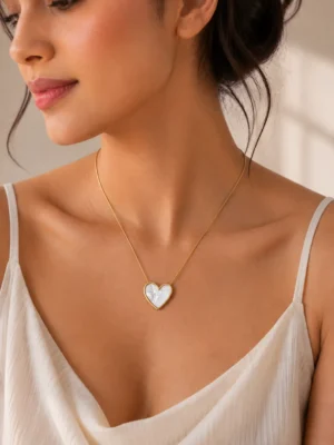 Gold tone heart pendant necklace close-up