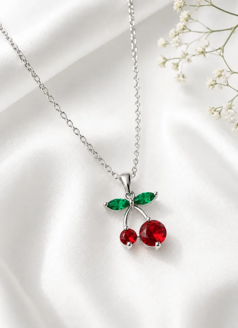 Silver cherry charm pendant necklace with red cherries and green leaves