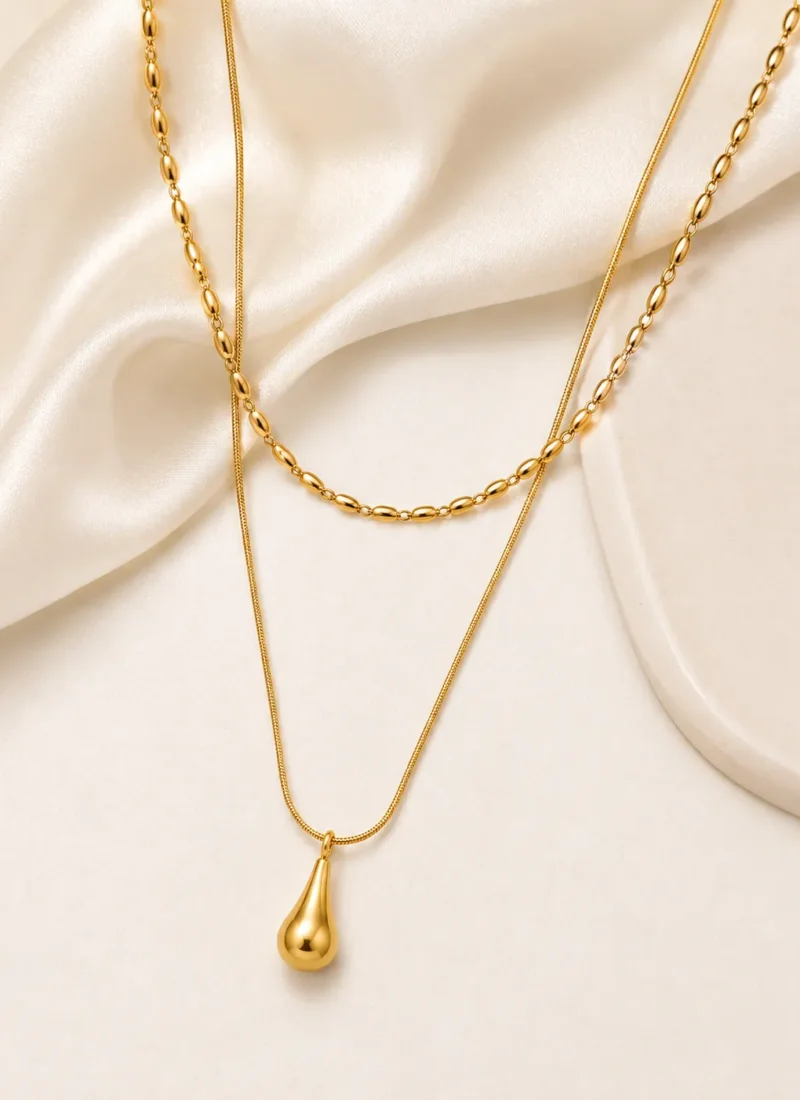 Golden teardrop layered necklace with oval link chain